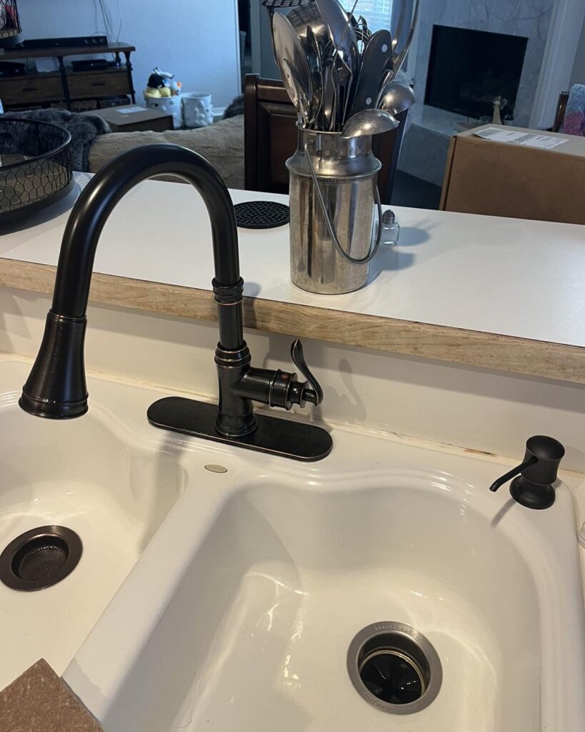 Rhead Plumbing installed new fixtures for this kitchen sink! Looks great! This is the after image.