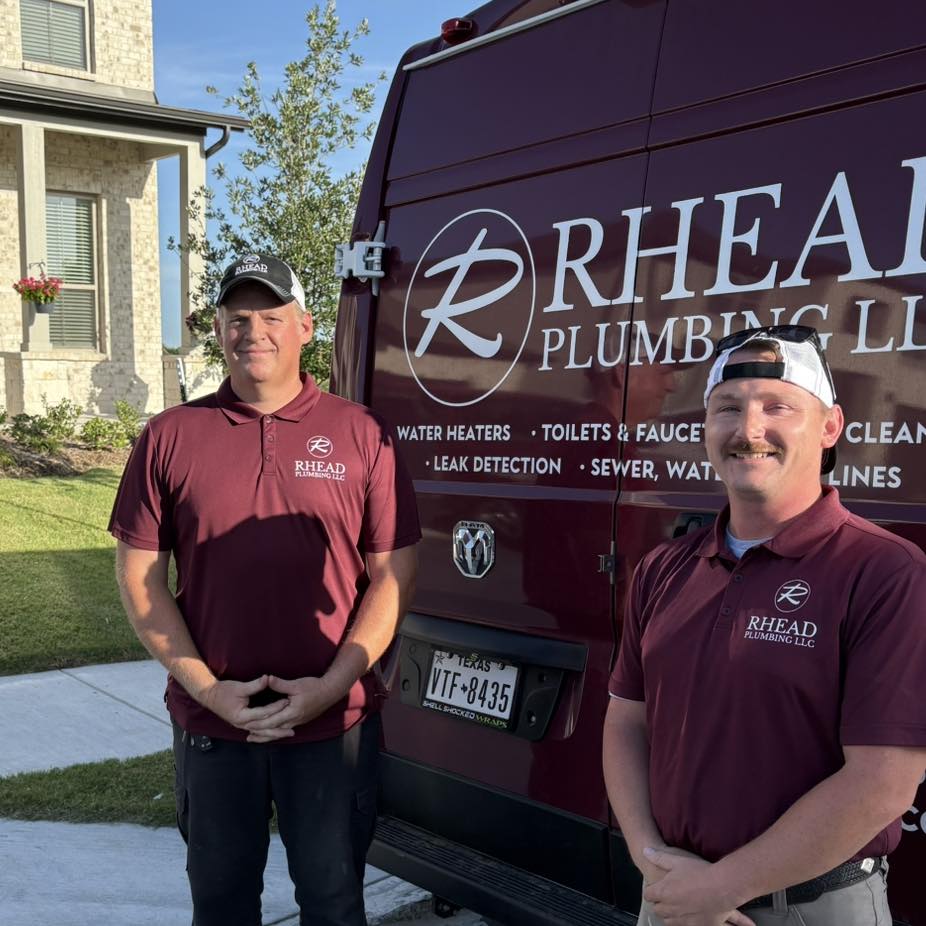 Joe Rhead and Tyler in front of Rhead Plumbing service van